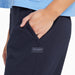 Close-up of side pocket with Life Is Good logo patch on Women’s Crusher-Flex Jogger in Inkwell Blue.
