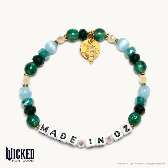 Little Words Project Made In Oz bracelet inspired by Wicked with green and aqua beads, letter beads, and gold Wicked charm