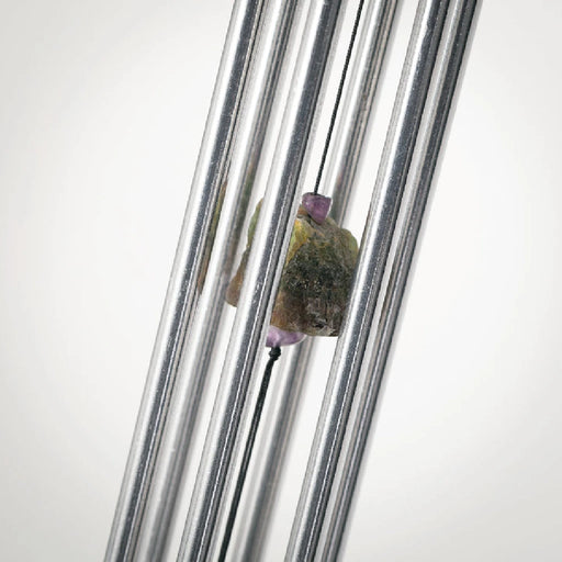 Art glass wind chime with artisan swirl design featuring colorful glass feather accent