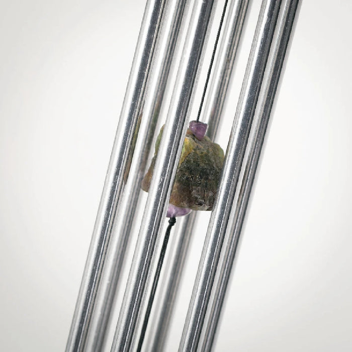 Art glass wind chime with artisan swirl design featuring colorful glass feather accent