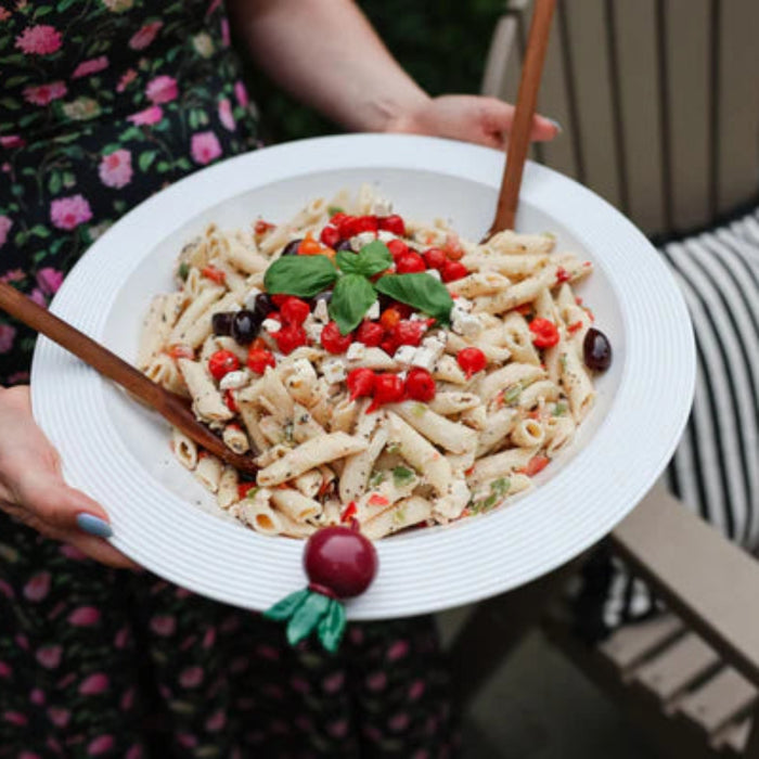 Nora Fleming White Shallow Melamine bowl Filled with Pasta Salad being served