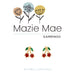 Earrings with floral design and red gemstones on a white background, branded as Mazie Mae.