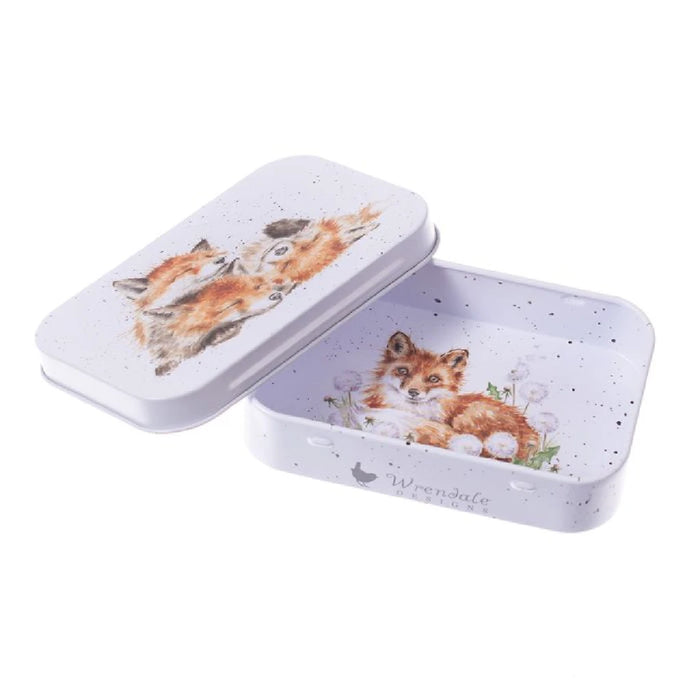A small tin box featuring a whimsical fox design on its surface.