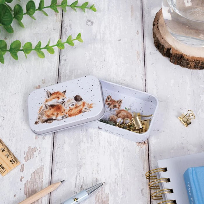 A decorative tin box adorned with a charming fox illustration.