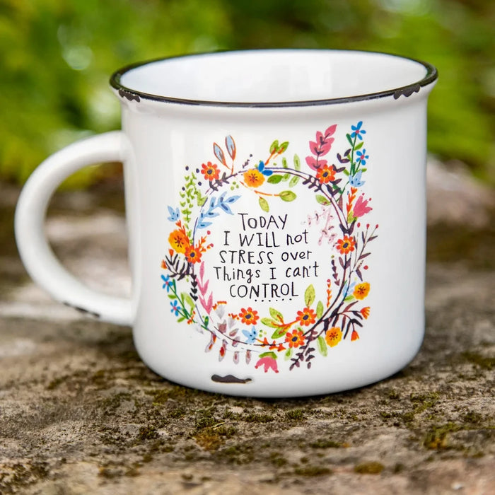 A coffee mug featuring an inspirational quote printed on its surface.