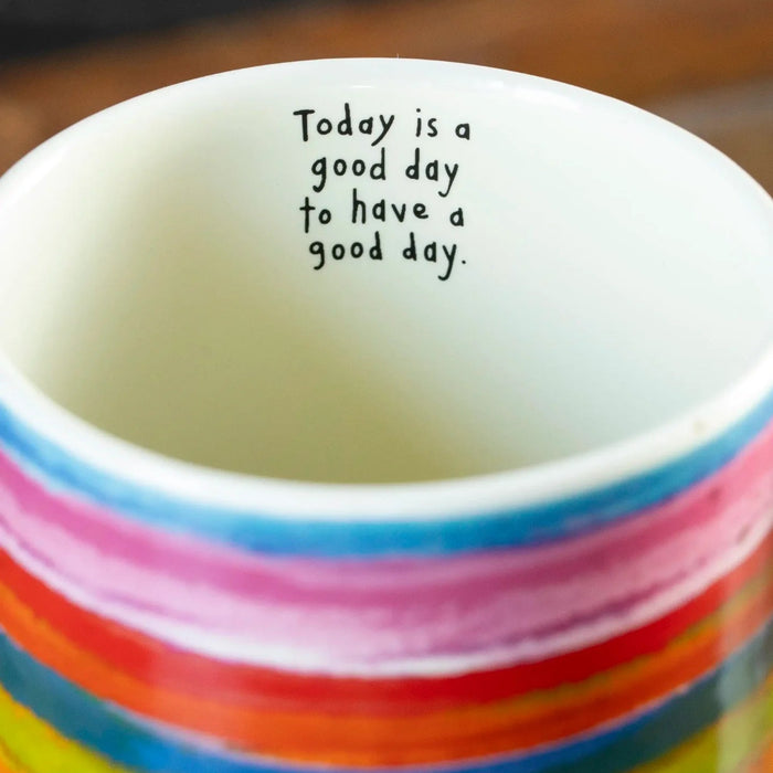 Rainbow latte mug with a colorful design for coffee, tea, and other favorite beverages.