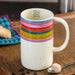 Rainbow latte mug with a colorful design for coffee, tea, and other favorite beverages.