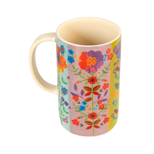 A vibrant floral patterned mug featuring a colorful design with various flowers and leaves.