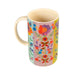 A vibrant floral patterned mug featuring a colorful design with various flowers and leaves.