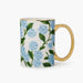 An elegant porcelain mug designed for enjoying your favorite coffee, tea, or hot beverages in style.