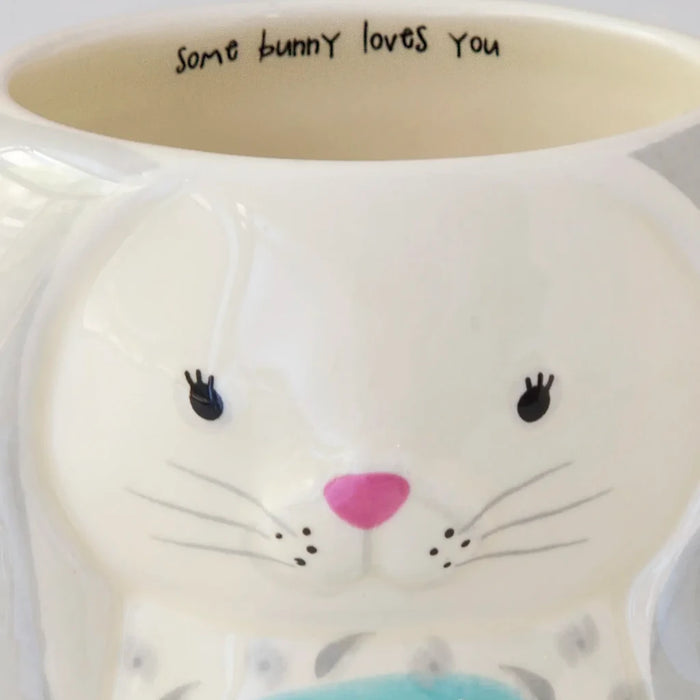 A white mug with a delightful bunny motif, designed for cozy moments with your favorite hot drink.