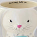 A white mug with a delightful bunny motif, designed for cozy moments with your favorite hot drink.