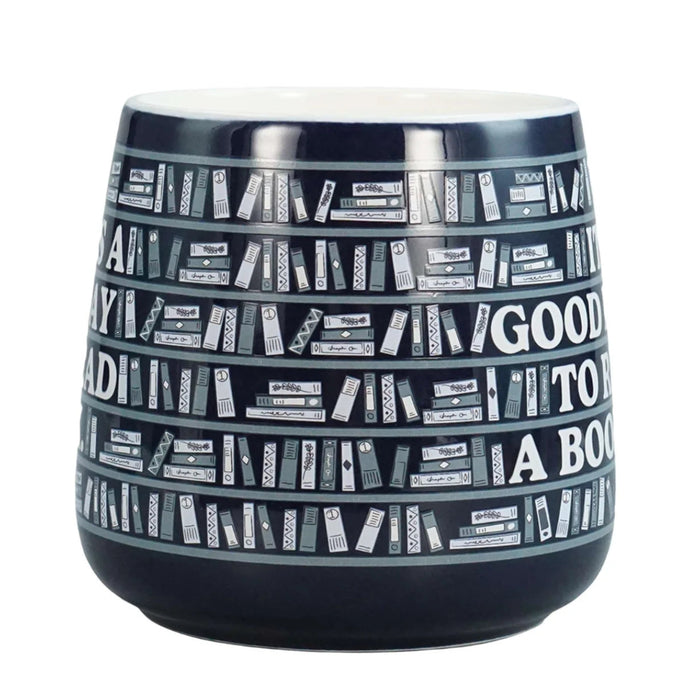 Ceramic mug featuring "It's A Good Day To Read A Book" quote for book lovers enjoying coffee or tea.