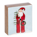 Wooden block with a Christmas-themed design featuring Santa Claus holding a tree and wreath.