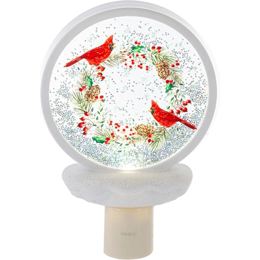 Decorative night light with cardinals and a wreath design on a white background