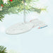 Star Trek ship ornament hanging on a Christmas tree