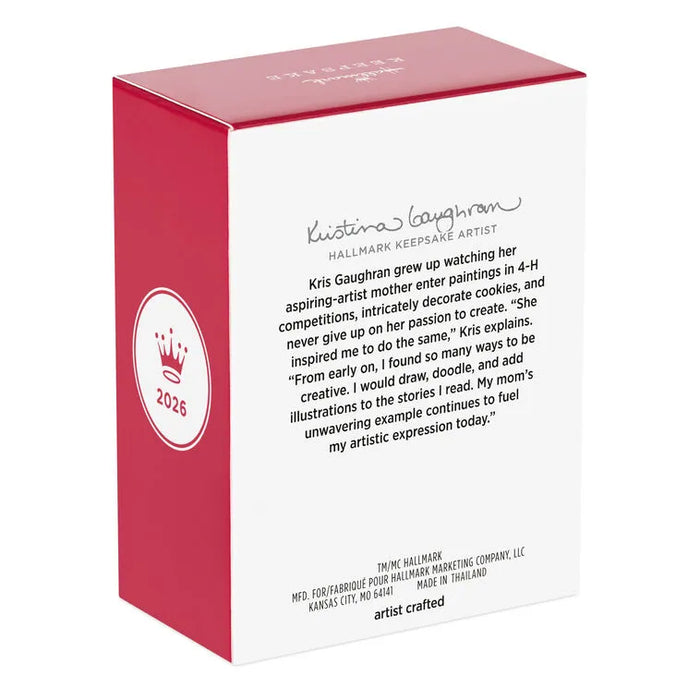 Hallmark Keepsake ornament box side panel with artist bio for Kristina Gaughran and 2026 crown logo