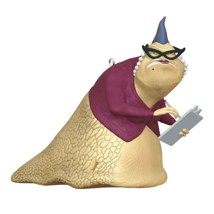 Animated character figurine with a purple sweater and glasses holding a tablet on a white background