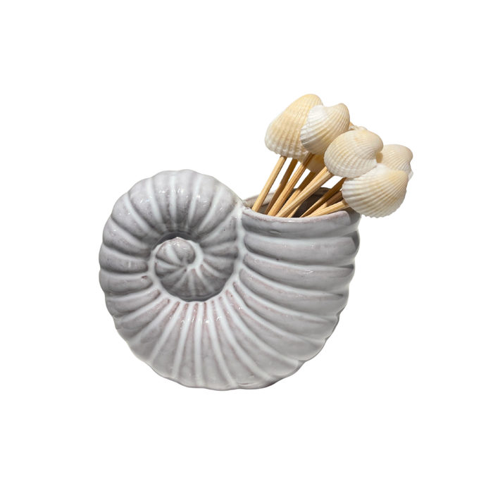 Mud Pie Ceramic Toothpick Holder shaped like a white nautilus conch shell, holding wooden toothpicks with small shell tops.