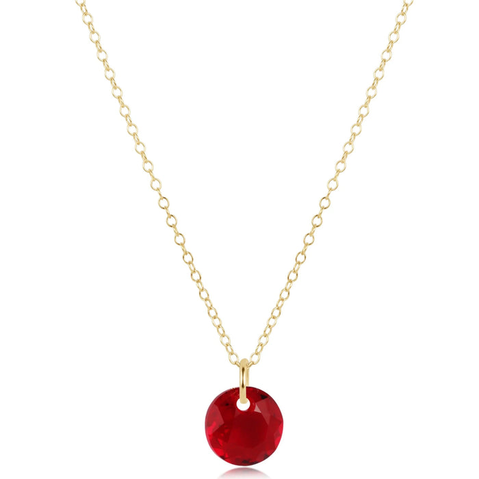 This delicate gold tone necklace featuring a dazzling faceted crystal pendant. 