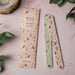 A pair of nail files with a decorative pink and white pattern, displayed together on a flat surface.
