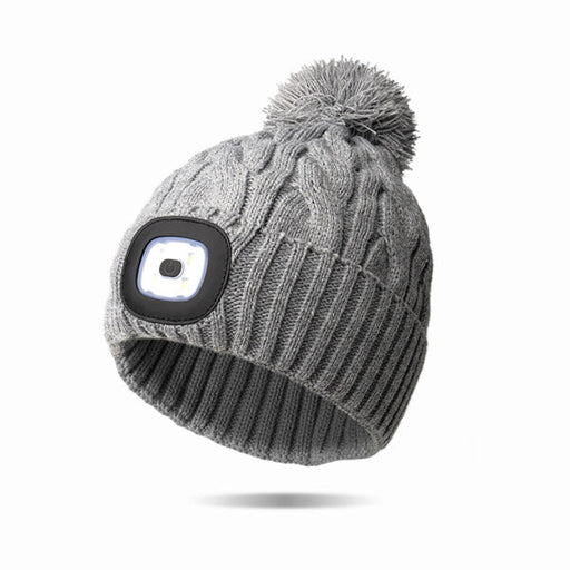 Soft hat with a cute pom on top with a light
