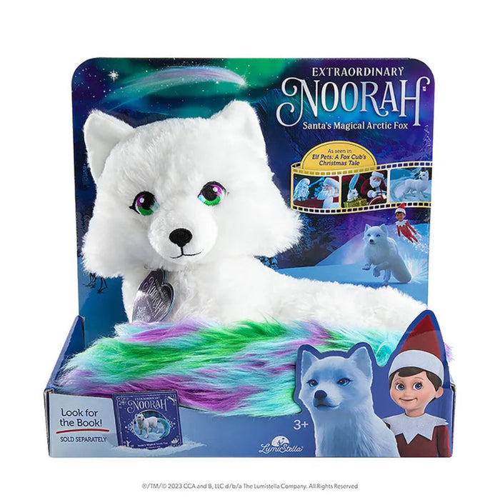 White plush toy artic fox with rainbow fur in a colorful packaging
