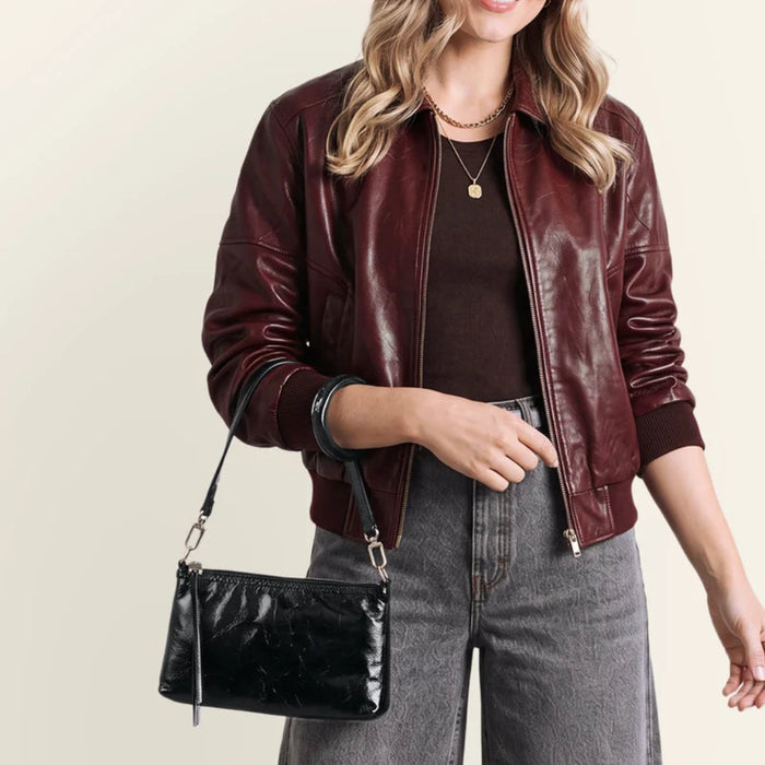 This HOBO Darcy Small Crossbody Bag in Black offers a sleek look and everyday convenience in one compact design.