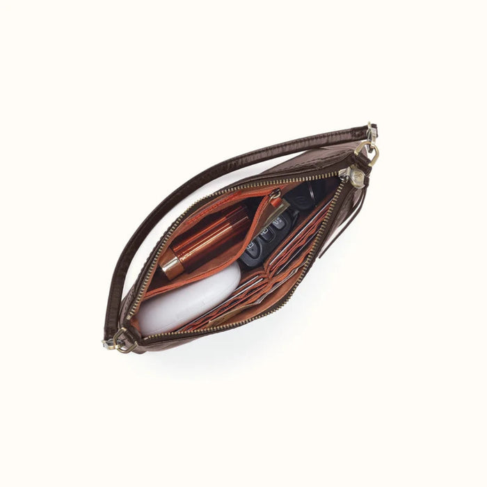 This HOBO Darcy Small Crossbody Bag in Black offers a sleek look and everyday convenience in one compact design.
