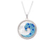 A blue and white wave pendant hanging from a silver chain, showcasing a stylish and elegant design.