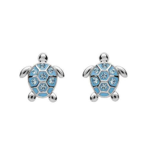 A pair of blue turtle earrings featuring intricate designs and a shiny finish, hanging from silver hooks.
