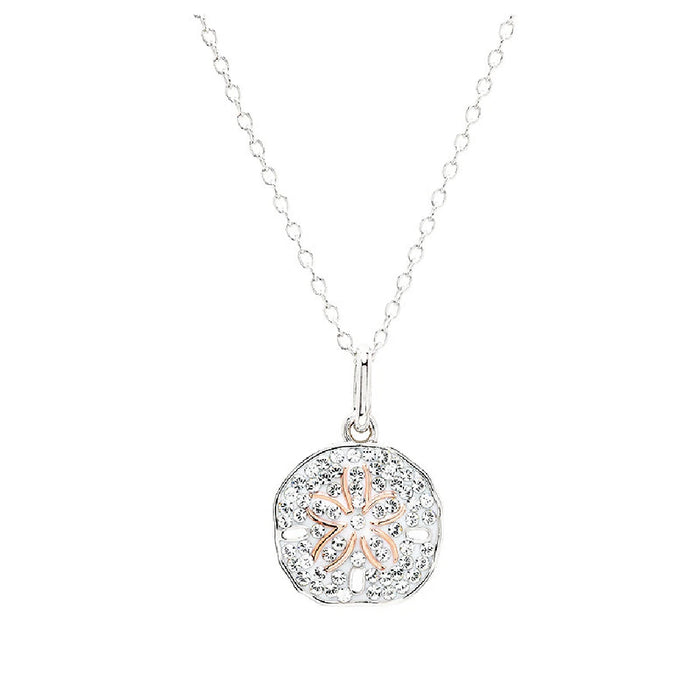 A pendant combining silver and rose gold, adorned with a floral motif.