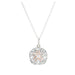 A pendant combining silver and rose gold, adorned with a floral motif.