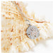 A floral pendant crafted from silver and rose gold, showcasing elegance.