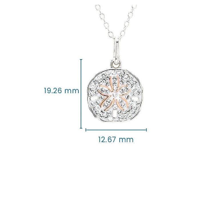 A silver and rose gold pendant with an intricate flower embellishment.