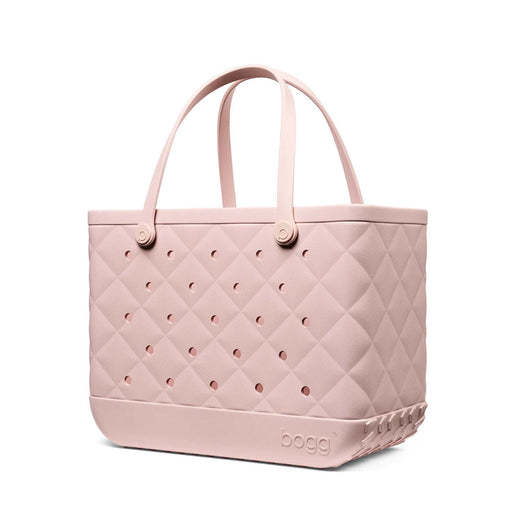 Side view of the Original Bogg Bag in Quilted Rose Petal featuring quilted texture, ventilation holes, and sturdy handles