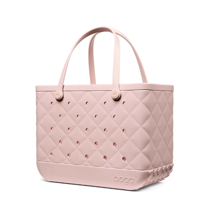 Side view of the Original Bogg Bag in Quilted Rose Petal featuring quilted texture, ventilation holes, and sturdy handles