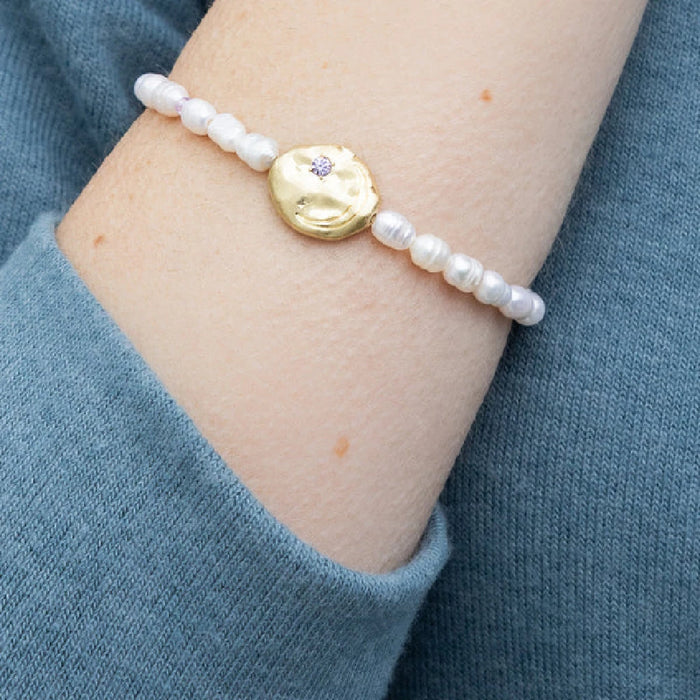 Exquisite pearls of protection bracelet, emphasizing its charm and meaning, displayed on a soft, neutral background.
