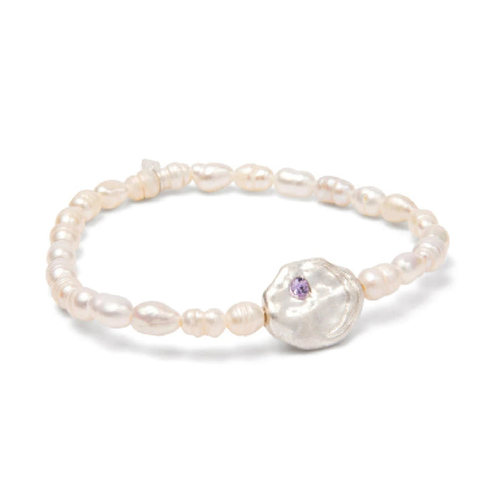 Elegant white pearl bracelet adorned with a purple gemstone.