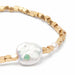A beautifully crafted "pearls of courage" bracelet with radiant pearls, embodying courage and elegance in its design.