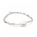 Elegant white pearl bracelet featuring green stones, perfect for adding a touch of color to any outfit.