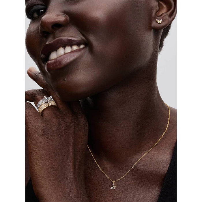 Woman wearing Pandora Butterfly Gold Pendant Necklace with matching butterfly earrings and rings.