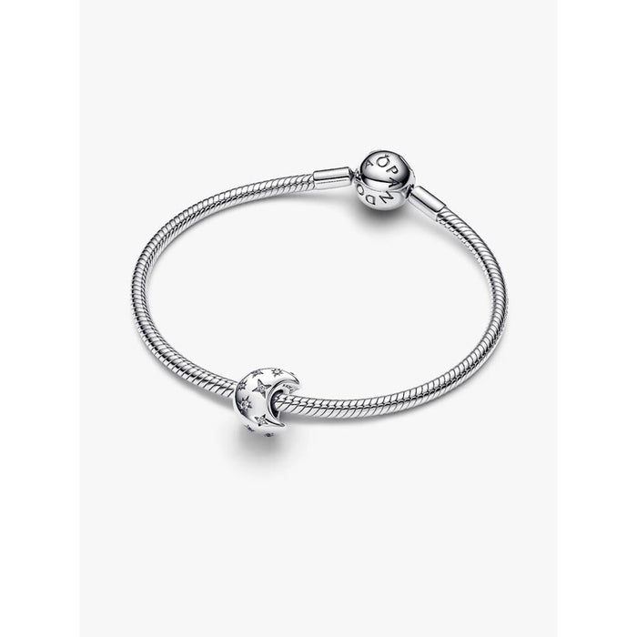 Pandora Crescent Moon Charm displayed on a sterling silver Pandora Moments bracelet on white background.