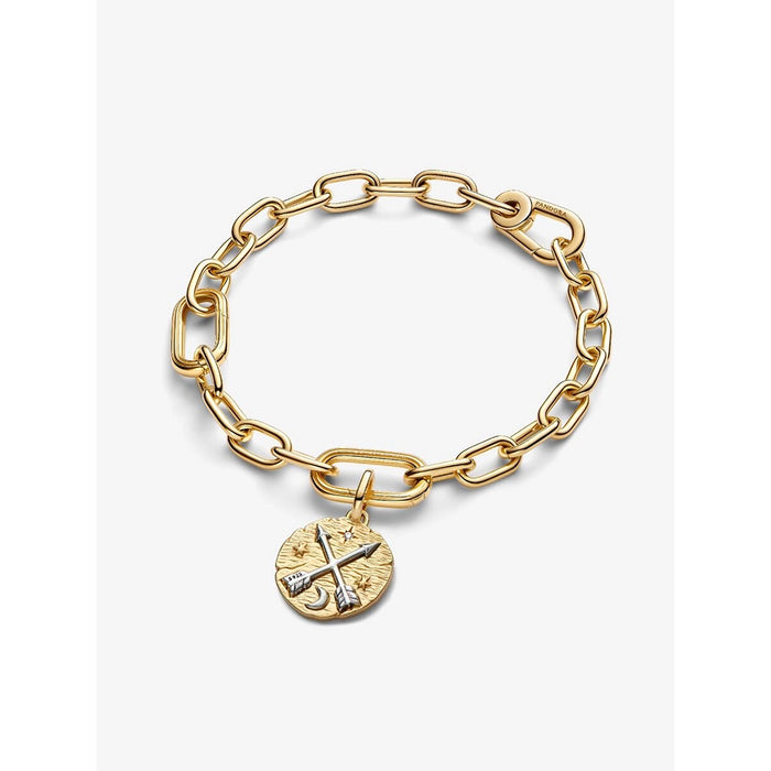 Product shot of a gold link bracelet with the Pandora Crossing Arrows Medallion Charm attached, laid flat against a white background.