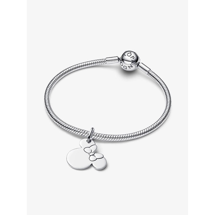 Pandora Disney Minnie Mouse Dangle Charm styled on a silver bracelet.