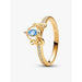 Close-up of Pandora Cinderella gold ring featuring blue marquise cubic zirconia and pavé stone band.