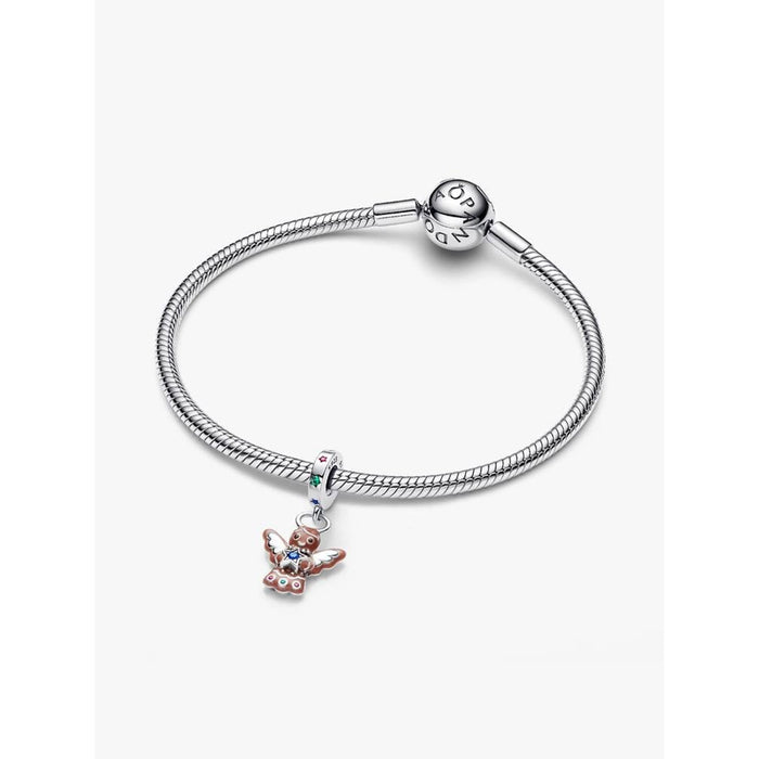 Pandora Moments bracelet featuring the Gingerbread Angel Dangle Charm styled on a silver snake-chain bracelet.