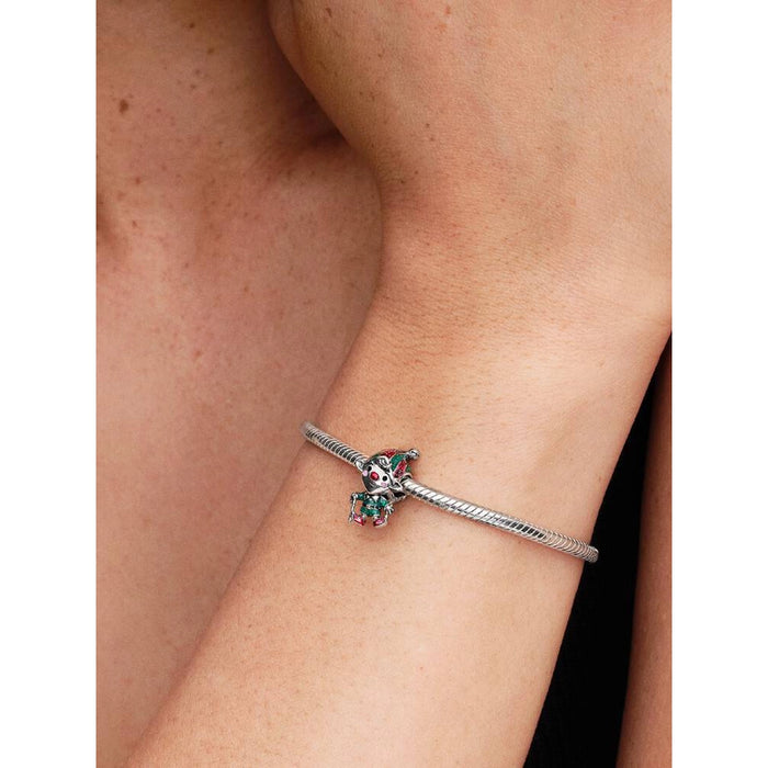 Pandora Moveable Elf Charm worn on a silver bracelet, showing the festive red and green enamel details.