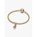 Gold Pandora bracelet featuring the Moveable Nutcracker Dangle Charm with pink enamel detailing.