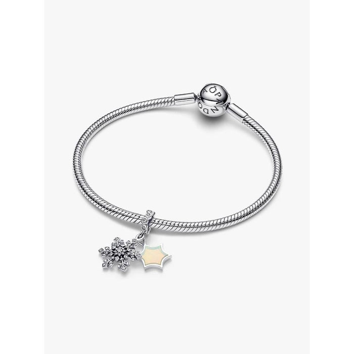 Pandora Moments snake chain bracelet featuring the Opalescent Snowflake Double Dangle Charm displayed on the bracelet.